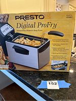 Box of Presto Digital ProFry immersion element deep fryer showing product information and features.