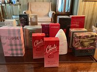 Overview of all boxed fragrance items on table