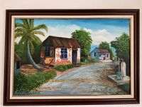Framed oil painting of rural scene with houses and palm tree, signed Eric Campbell '98.