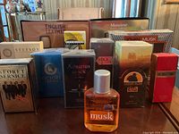 Photo showing most of the cologne bottles and boxes arranged on a table, featuring Aqua Velva Musk bottle prominently in front.