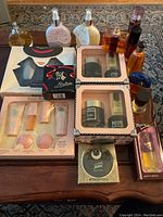 Overview of the lot showing multiple vintage Lentheric perfume bottles and boxed gift sets on table