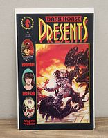 Front cover photo of Dark Horse Comics Presents issue 36 featuring Aliens vs Predator artwork and highlighted first appearance.