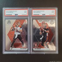 Two Joe Burrow graded trading cards side by side, showing full front face of cards with details and grading visible