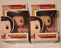 Front view of two boxed Funko POP Richard Simmons figures, both labeled as Target exclusives, model 59.