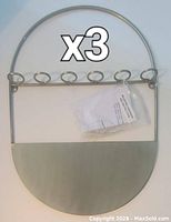 Wall mount propagation vessel with six circular holders and attached hanging hook, showing the design and materials.