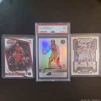 Three Scottie Barnes rookie basketball cards displayed, with center card PSA graded and slabbed.
