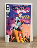 Front cover of the signed DC Multiverse comic issue 35 titled Batter Up Harley Quinn Part One introducing Batwoman.