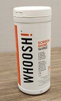 Front view of the white plastic container of Whoosh! Screen Shine Wipes with product name and description.