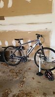 Grey Diamondback Trace Sport mountain bike with front suspension and water bottle cage