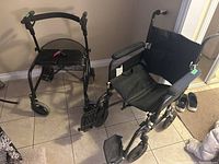 Front view of wheelchair and rollator side by side