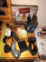 Overview photo showing entire lot including shavers, pipes, cologne set, flask, and accessories on wood surface.