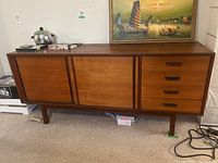 Front view showing overall condition, drawers and sliding doors