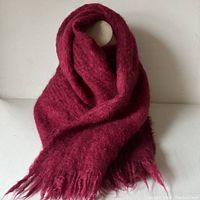 Full view of cranberry red mohair scarf wrapped to display texture and color.