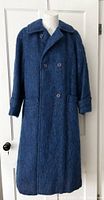 Full front view of a long dark blue vintage mohair and wool coat on a mannequin, showing wide collar, long sleeves with cuff straps, and front patch pockets.