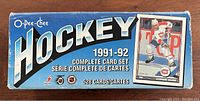 Blue box of 1991-1992 O-Pee-Chee Hockey Complete Card Set with 528 cards indicated on box front featuring player photo.