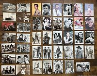 Overview of 43 different vintage postcards arranged in rows showing various movie stars, western themes, and classic film scenes mostly black and white with some color images.