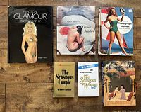 Overview of all six books laid flat showing front covers, includes Practical Glamour Photography, Figure Studies, Photograph Women, Sensuous Couple, Sensuous Woman, and Kama Sutra.