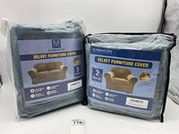 Photo showing the two packaged velvet furniture covers, one 3-piece and one 2-piece.