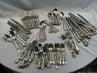 Full layout of all 110 pieces arranged on grey fabric background.