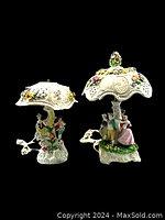 Front view: both lamps on black background showing smaller left and larger right.