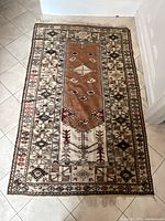 Full top-down view of rug on tiled floor