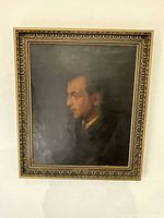 Full view of framed oil painting showing profile of a man