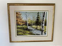Full view of framed oil painting showing autumn landscape with path and trees