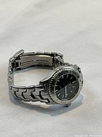 Three-quarter view of watch showing bracelet shape and overall condition