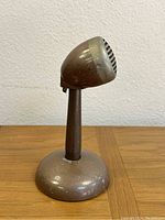Side angled view of the vintage Phonocord microphone showing shape and wear