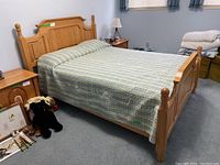Assembled bed frame with quilt displayed