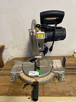 Full view of the Mastercraft Hawkeye laser table saw including power cord, blade, and attached handle.