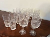 Photo showing all 16 glasses in the set including 8 wine glasses with stems and 8 highball glasses.