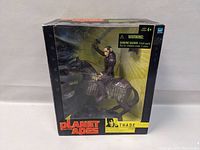 Front view of new in box Planet of the Apes Thade action figure mounted on armored horse.