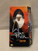 Front view of Star Trek The Mugato figure in original window display box showing the alien figure with white fur and detailed face.
