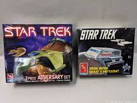 Full front view of both sealed Star Trek model kit boxes: the 3-piece adversary set and the special edition Galileo II shuttlecraft