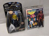 Sulu and Klingon Star Trek action figures in original packaging, displayed side by side.