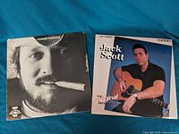 Photo of two vinyl record covers side by side: Ronnie Hawkins' 'The Hawk' on the left, Jack Scott's 'The Original Recordings' on the right.
