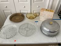 Full view of the assorted serving platters and chip and dip set displayed on a table.