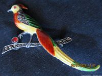 Side angled view showing the full brooch highlighting the colorful enamel and marcasite accented branch.