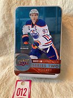 Metal tin featuring Connor McDavid on front, 2017-18 Upper Deck Series 2 Hockey branding.