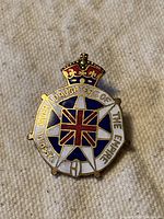 Front of vintage Daughters of the Empire brooch pin showing detailed enamel colors and crown design.