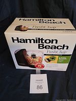 Front view of Hamilton Beach FreshChop food chopper box showing product image and branding.