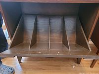 Interior view showing five wood-divided record storage compartments