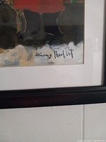 Close-up photo of artist signature 'Lucy Beaditt' on the print.