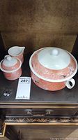 Front view of all three Sienna pattern pieces showing the lidded large baking dish, sugar bowl with lid, and creamer pitcher.