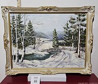Front view of the framed oil painting showing a winter landscape with trees, snow, and a winding road.