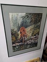 Framed 'Cougar Creek' art print by Sue Coleman hanging on wall, showing full view of the artwork within frame and matting.