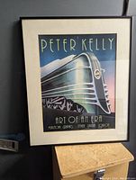 Framed poster showing full image of streamlined silver locomotive train labeled 'Peter Kelly Art Of An Era'.