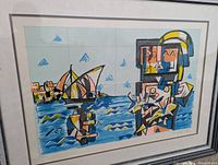 Front view of framed serigraph showing abstract coastal scene with boat and figure.
