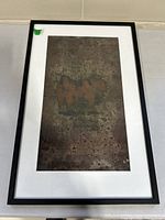 Full view of the framed abstract cityscape painting showing composition and frame.